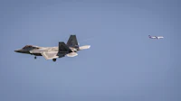 a jet flying in the sky